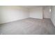 A bright bedroom features carpet flooring and white walls at 211 Ames Dr, Whiteland, IN 46184