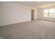 A large bedroom offers a door and a window at 211 Ames Dr, Whiteland, IN 46184