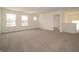 A spacious bonus room provides great natural light and carpeting at 211 Ames Dr, Whiteland, IN 46184