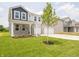 Beautiful two-story home with a well-manicured lawn and a three-car garage at 211 Ames Dr, Whiteland, IN 46184