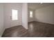 Bright foyer with wood flooring and a view into the living area at 211 Ames Dr, Whiteland, IN 46184