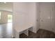 Entryway featuring a built-in bench and coat rack, providing convenient storage space at 211 Ames Dr, Whiteland, IN 46184