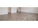 Bright living room featuring wood flooring and views of the home's upper level at 211 Ames Dr, Whiteland, IN 46184
