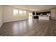 Open-concept living area with a kitchen featuring dark cabinets and stainless steel appliances at 211 Ames Dr, Whiteland, IN 46184