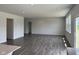 Spacious living room with hardwood floors, recessed lighting, and a sliding glass door at 211 Ames Dr, Whiteland, IN 46184