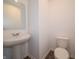 Clean and modern powder room with a pedestal sink and a contemporary design at 211 Ames Dr, Whiteland, IN 46184