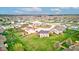 An aerial view of the neighborhood featuring a pond and surrounding residential homes and grassy yards at 2209 Foxfire Ct, Greenfield, IN 46140