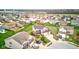 Aerial view of a residential neighborhood with green lawns, tree-lined streets, and varied architectural styles at 2209 Foxfire Ct, Greenfield, IN 46140