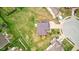 A bird's-eye view showcases the home's roof, driveway, and surrounding greenery in the neighborhood at 2209 Foxfire Ct, Greenfield, IN 46140