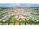 Expansive aerial view showcasing a tranquil residential community with ponds and lush landscaping at 2209 Foxfire Ct, Greenfield, IN 46140