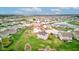 An aerial view of the neighborhood featuring a pond and surrounding residential homes and grassy yards at 2209 Foxfire Ct, Greenfield, IN 46140