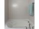 Bathroom featuring modern soaking tub with chrome fixtures at 2209 Foxfire Ct, Greenfield, IN 46140