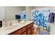 Bathroom featuring a double vanity, an octopus-themed shower curtain, and ample storage at 2209 Foxfire Ct, Greenfield, IN 46140