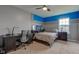 Bedroom with neutral walls, a desk, fan, and an accent wall with painted stripe at 2209 Foxfire Ct, Greenfield, IN 46140