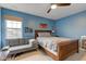 Bedroom with neutral walls, a fan, comfortable seating and large window views at 2209 Foxfire Ct, Greenfield, IN 46140