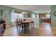 Charming dining area with wood floors, natural light, and adjacent kitchen at 2209 Foxfire Ct, Greenfield, IN 46140