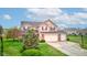Traditional two-story home with a two-car garage, landscaped yard, and classic curb appeal at 2209 Foxfire Ct, Greenfield, IN 46140