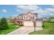Attractive two-story house with two-car garage and inviting front yard landscaping at 2209 Foxfire Ct, Greenfield, IN 46140