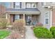 Inviting front porch with brick facade and a swing at 2209 Foxfire Ct, Greenfield, IN 46140