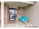 Welcoming front porch featuring a charming swing and a clear view through the front door at 2209 Foxfire Ct, Greenfield, IN 46140