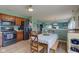 Well-equipped kitchen with dark appliances, wood cabinets, and breakfast area at 2209 Foxfire Ct, Greenfield, IN 46140