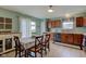 Eat-in kitchen boasts wood cabinets, modern appliances, and natural light at 2209 Foxfire Ct, Greenfield, IN 46140