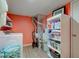 Functional laundry room with modern washer, dryer, utility sink, and shelving for efficient organization at 2209 Foxfire Ct, Greenfield, IN 46140
