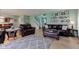 Bright and airy living room with light green walls, wood floors, and plenty of seating at 2209 Foxfire Ct, Greenfield, IN 46140