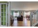 Open-concept living room and dining area with wood floors at 2209 Foxfire Ct, Greenfield, IN 46140