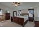 Spacious main bedroom with a ceiling fan, sitting area, and large dresser at 2209 Foxfire Ct, Greenfield, IN 46140