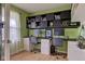 Home office with built-in shelving and dual monitor setup at 2209 Foxfire Ct, Greenfield, IN 46140