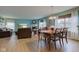 Open concept living and dining area with wood floors and lots of natural light at 2209 Foxfire Ct, Greenfield, IN 46140