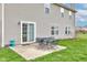 Patio area with dining table, and access to a large yard at 2209 Foxfire Ct, Greenfield, IN 46140