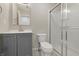 Clean bathroom with gray vanity, modern fixtures, toilet, and a shower with glass door at 2405 Providence Ct, Greenwood, IN 46143
