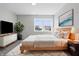 Cozy bedroom featuring soft carpet, light wood furniture, and a large window view at 2405 Providence Ct, Greenwood, IN 46143