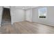 Bright entryway featuring new vinyl flooring, fresh paint, and a staircase to the upper level at 2405 Providence Ct, Greenwood, IN 46143