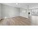 Open-concept living room with new vinyl flooring, fresh paint, and abundant natural light at 2405 Providence Ct, Greenwood, IN 46143