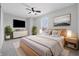 Serene bedroom featuring a ceiling fan, natural light, and minimalist decor at 2405 Providence Ct, Greenwood, IN 46143