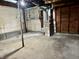 Unfinished basement with exposed ductwork and a utility area, offering potential for customization and added living space at 303 S Walnut St, Edinburgh, IN 46124