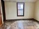 Bedroom with hardwood floors and a window overlooking the neighborhood, perfect for customization and personal touches at 303 S Walnut St, Edinburgh, IN 46124