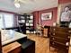 Spare bedroom featuring a desk and chair, wooden floors, and a window with natural light at 303 S Walnut St, Edinburgh, IN 46124