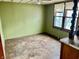 Bedroom with hardwood floors, a ceiling fan and large windows offering natural light and a view of the outdoors at 303 S Walnut St, Edinburgh, IN 46124