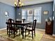 Bright dining room featuring a traditional table, hardwood floors, and natural light at 303 S Walnut St, Edinburgh, IN 46124