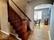 Home entryway featuring hardwood floors, stairs, and an open dining room at 303 S Walnut St, Edinburgh, IN 46124