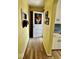 Hallway entrance featuring hardwood floors and classic interior decor at 303 S Walnut St, Edinburgh, IN 46124