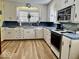 Clean kitchen featuring bright countertops, matching appliances, and hardwood floors at 303 S Walnut St, Edinburgh, IN 46124
