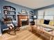 Charming living room with a cozy fireplace, built-in shelving, and comfortable seating at 303 S Walnut St, Edinburgh, IN 46124