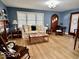 Comfortable living room with hardwood floors, large window, and classic decor at 303 S Walnut St, Edinburgh, IN 46124