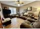 Cozy living room with leather furniture, hardwood floors, and natural light at 303 S Walnut St, Edinburgh, IN 46124