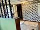 Bright room with unique vintage style wallpaper, adjacent to stairway, ready for personalized updates at 303 S Walnut St, Edinburgh, IN 46124